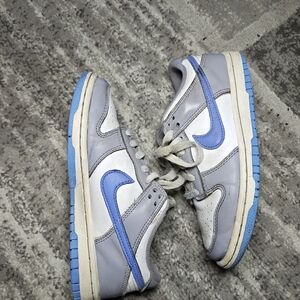The Nike Dunk Low Shoes in Kids size 4Y leather sneakers